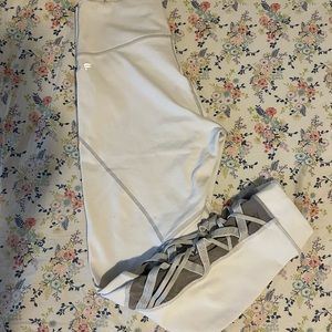 White Fabletics power hold leggings with mesh detail on side